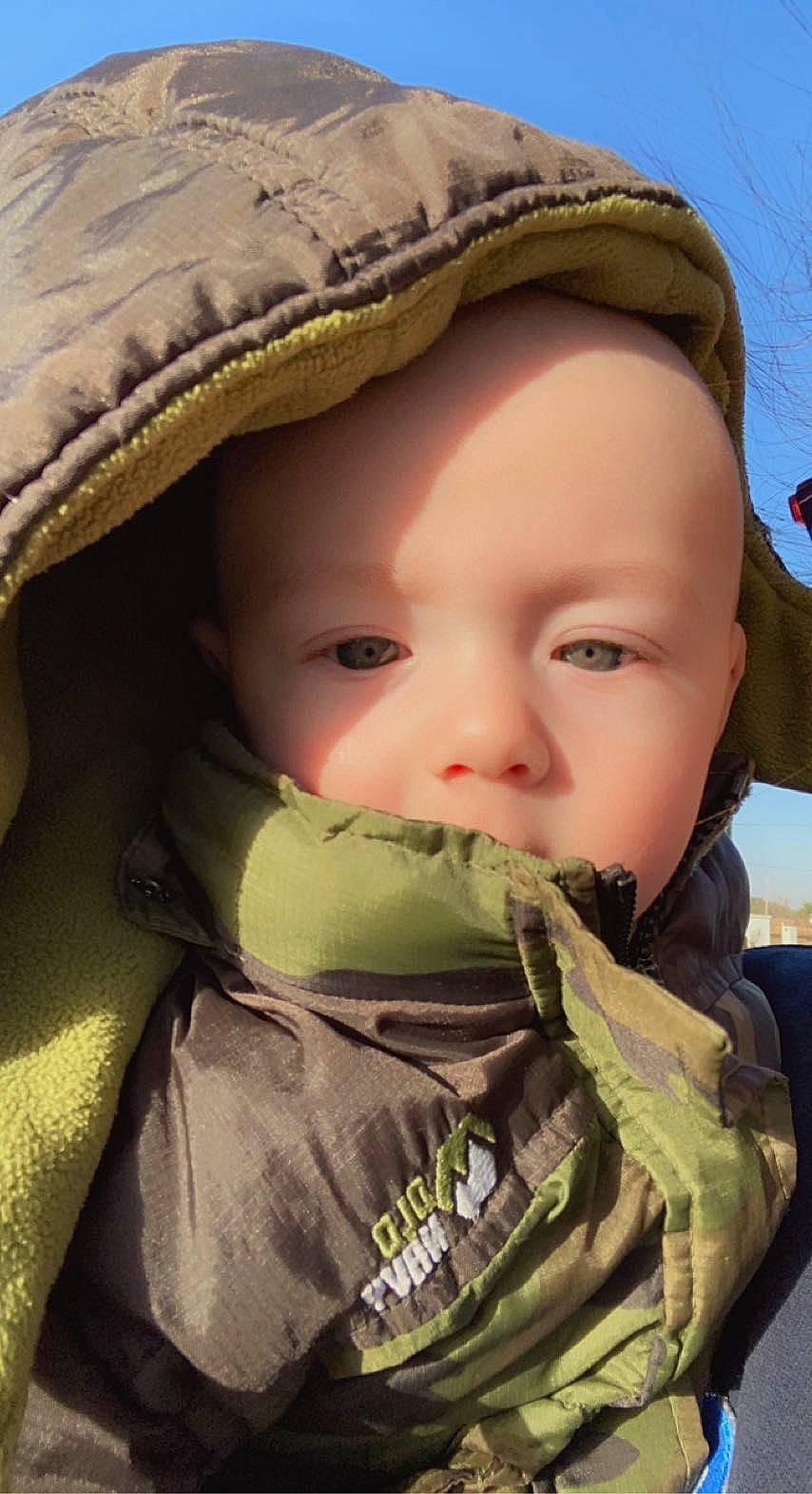 Jude is registered to the contest to win money with this photo: camouflage, cap, cheek, chin, eye, eyebrow, face, facial_expression, hairstyle, happy, hat, head, headgear, headwear, iris, lip, military_camouflage, mouth, nose, people_in_nature