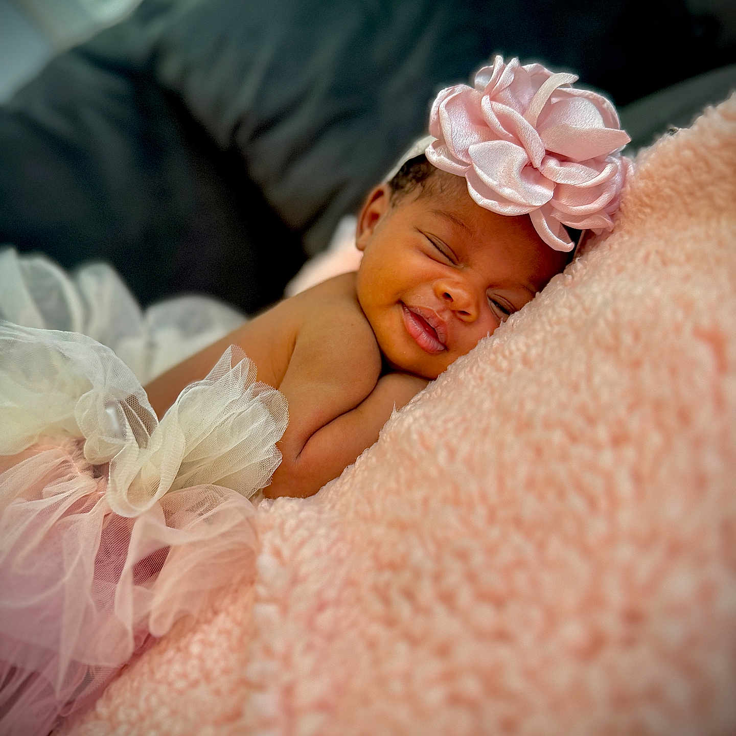Talisa is registered to the contest to win money with this photo: baby, blanket, child, closeup, cozy, cute, flower, happy, headband, indoors, infant, pink, portrait, relaxed, skin, skirt, sleeping, smiling, soft, tulle
