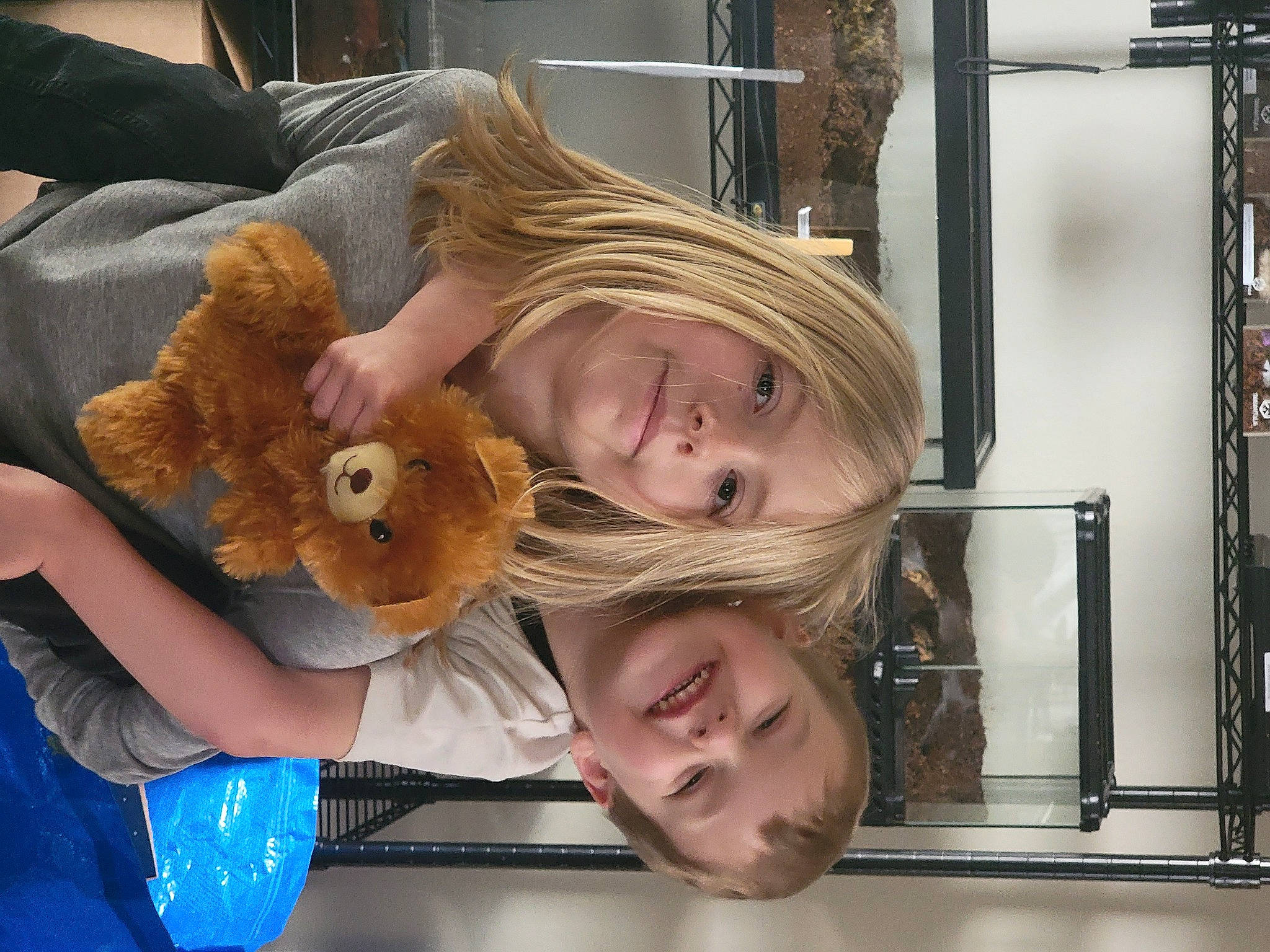 Makayla And Aiden joined the competition — help win amazing prizes! bangs, blond, child, comfort, companion_dog, doll, eyelash, fun, fur, happy, joy, person, plush, room, selfie, sitting, smile, stuffed_toy, toddler, toy