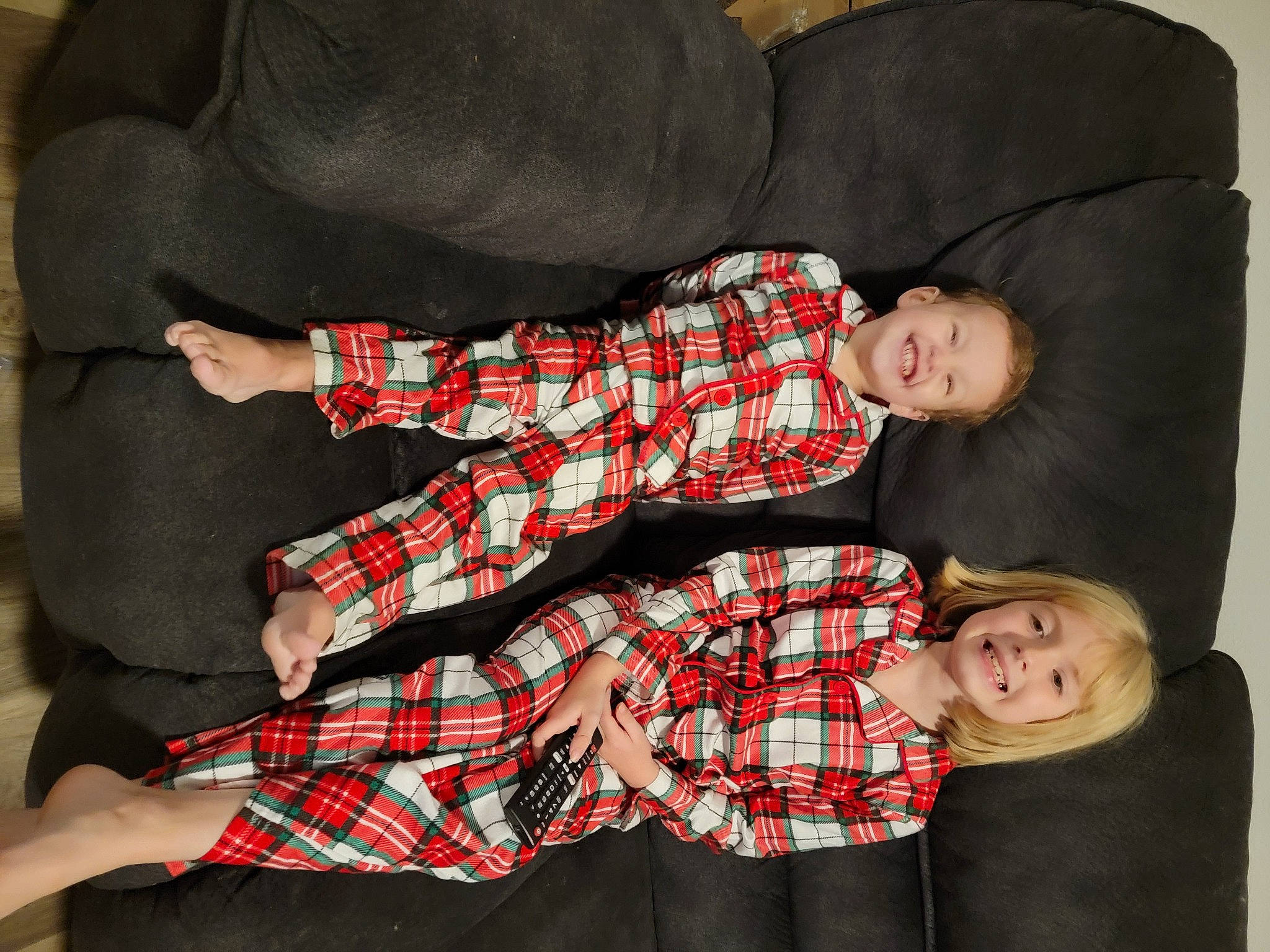 Makayla And Aiden is registered to the contest to win money with this photo: baby_toddler_clothing, child, collar, comfort, couch, event, fun, human_leg, joy, lap, linens, pattern, person, plaid, red, room, sitting, sleeve, smile, tartan