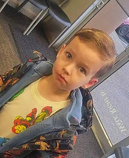 Aiden joined the competition — help win amazing prizes! child, cool, electronic_device, face, flooring, happy, metal, pattern, person, room, selfie, sitting, sleeve, sportswear, square, t_shirt, tattoo, toddler, travel, vehicle_door