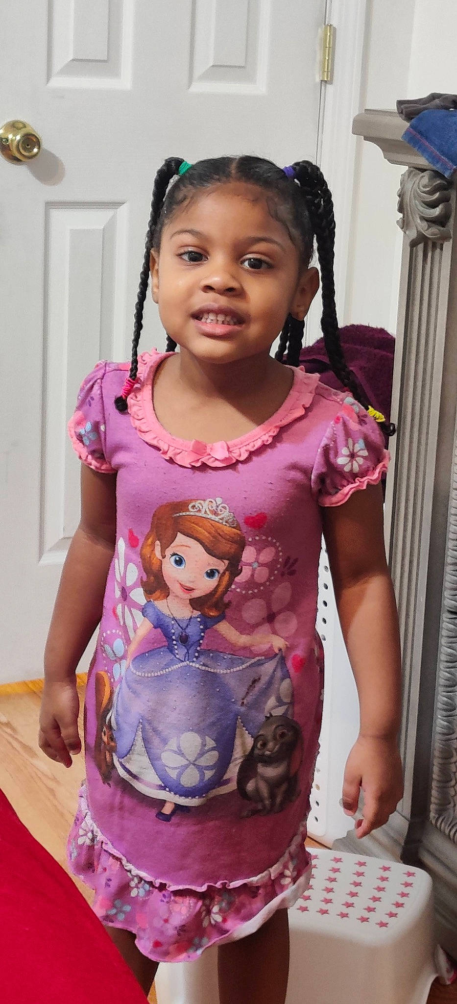 Isabella is registered to the contest to win money with this photo: cheek, child, child_model, face, head, neck, person, pink, purple, sleeve, smile, t_shirt, toddler