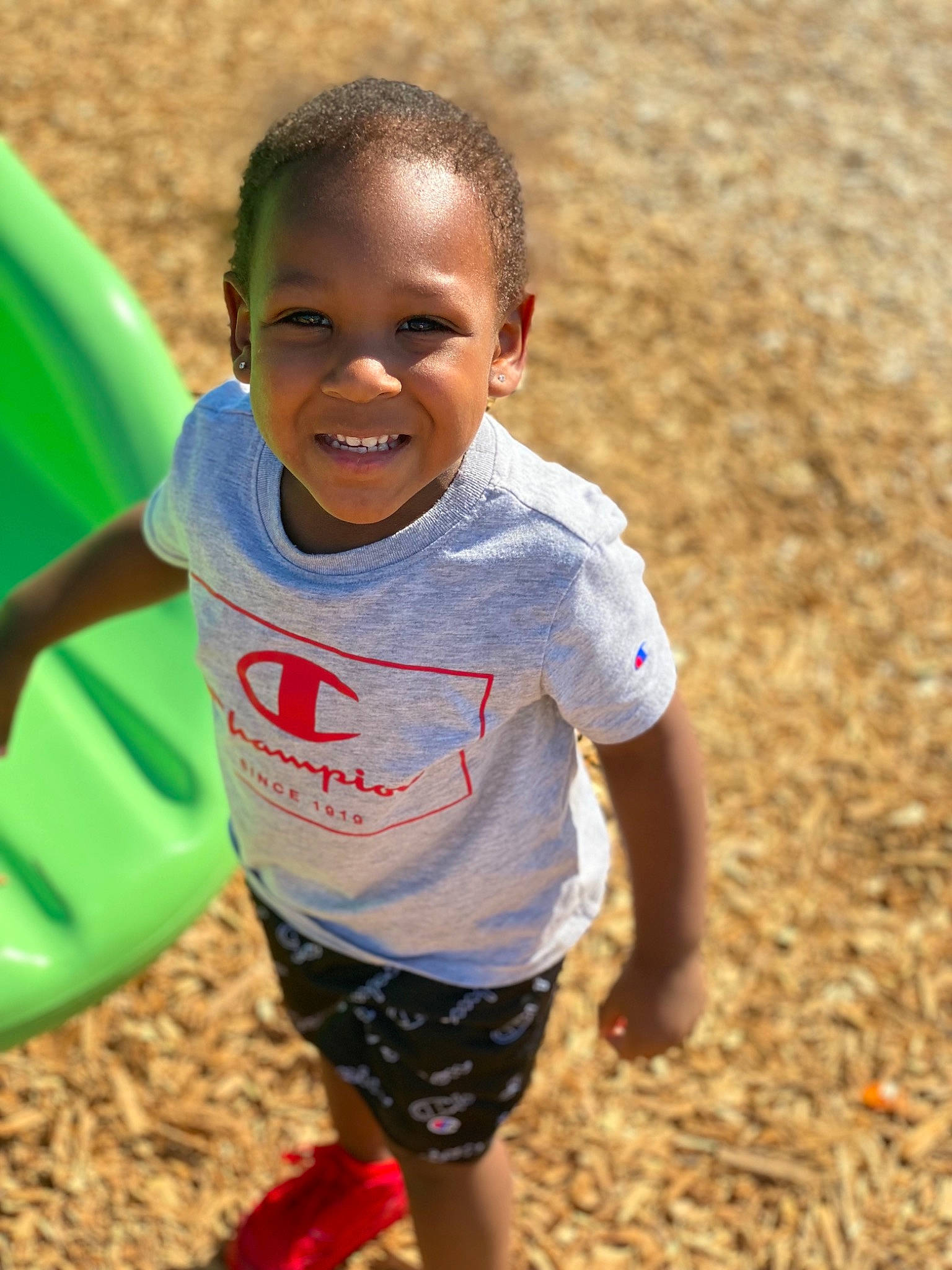 Maddux is registered to the contest to win money with this photo: baby, baby_toddler_clothing, child, cool, fun, grass, happy, head, human_body, joy, leisure, mouth, people_in_nature, person, recreation, shorts, sleeve, smile, soil, t_shirt