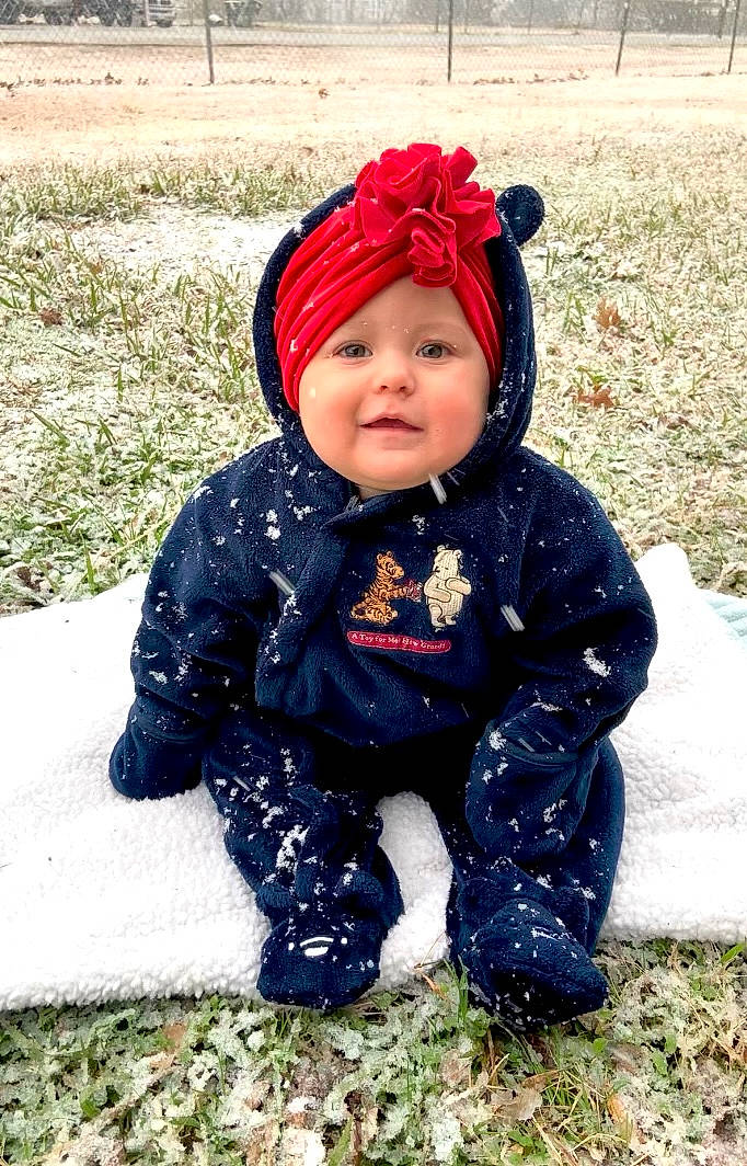 Juliet joined the competition — help win amazing prizes! baby, baby_toddler_clothing, cap, cheek, electric_blue, face, freezing, fun, grass, happy, headwear, jacket, outerwear, people_in_nature, person, plant, recreation, sleeve, smile, snow
