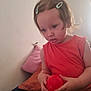 Selena joined the competition — help win amazing prizes! toddler, child, orange_clothing, red_ball, hair_clips, indoor, bed, pillow, soft_lighting, curly_hair, person, cute, toy, young_child, portrait, casual, home, relaxed, skin, face