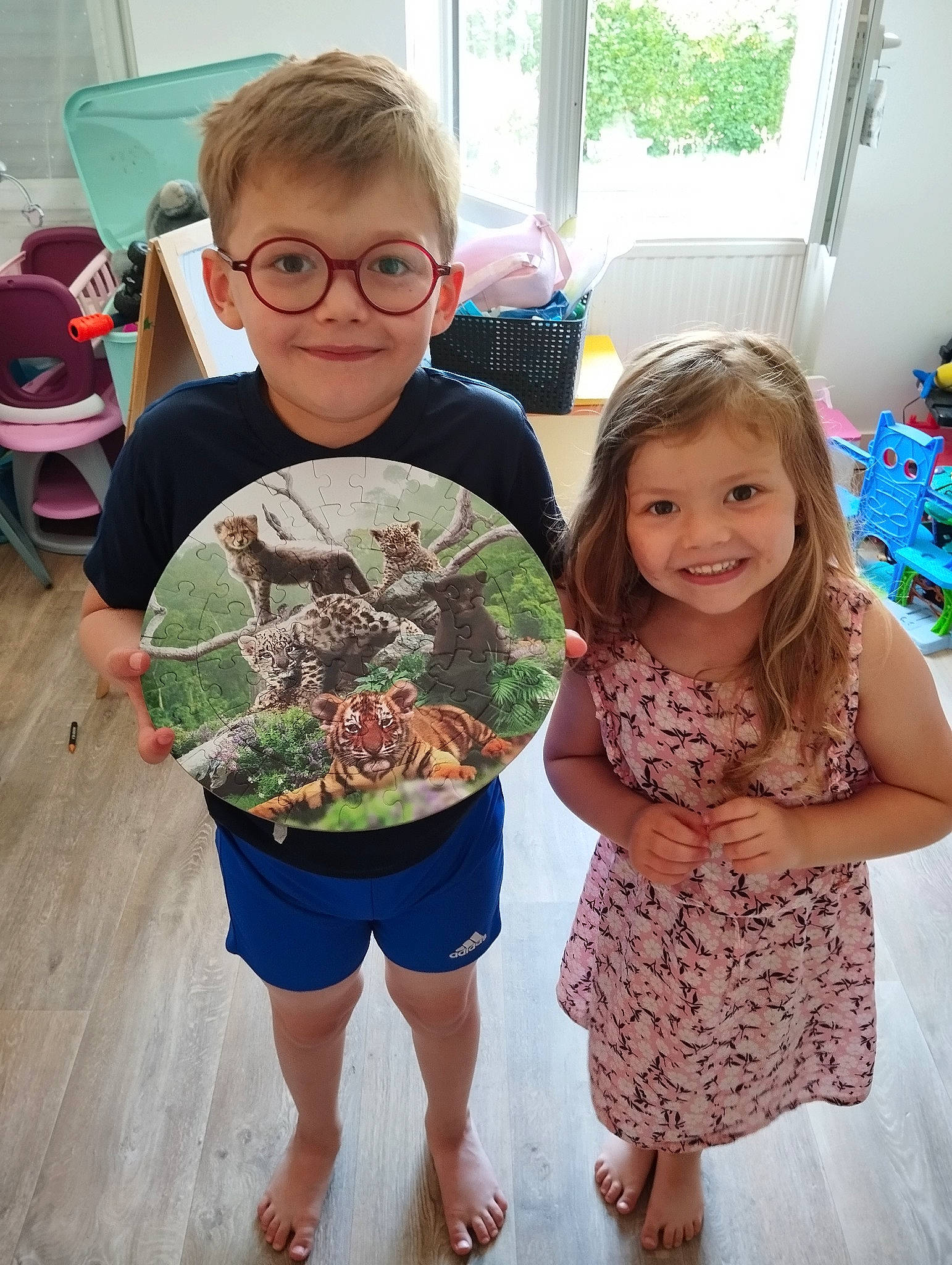 Soline participe au concours pour gagner de l'argent avec cette photo : art, chair, child, event, eyewear, fun, glasses, happy, head, joy, pattern, person, sandal, sharing, smile, summer, t_shirt, textile, toddler, vision_care