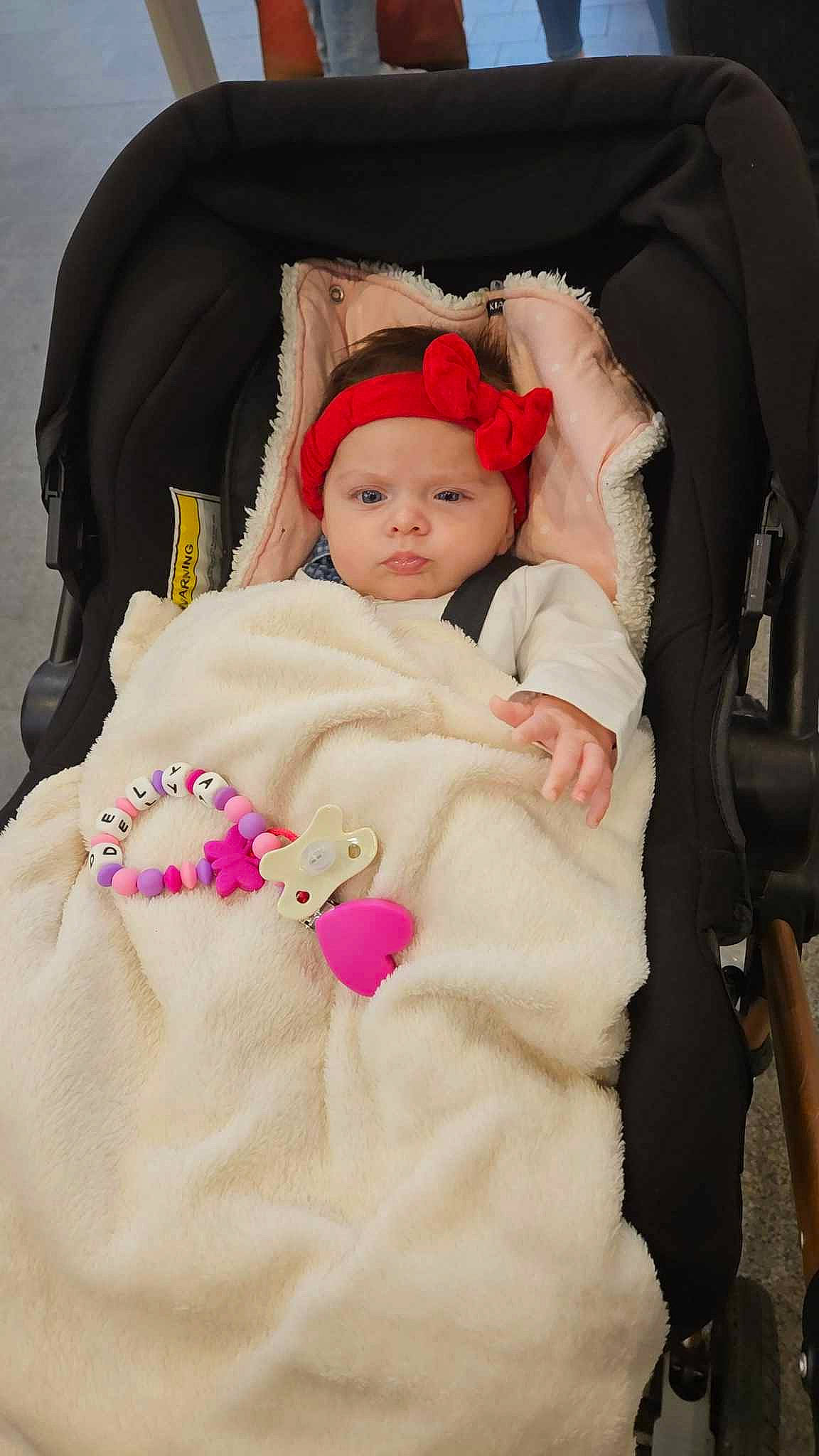 Delya participe au concours pour gagner de l'argent avec cette photo : baby, baby_carriage, baby_products, baby_safety, baby_sleeping, baby_toddler_clothing, cheek, child, comfort, fur, headwear, infant_bed, knit_cap, linens, magenta, person, pink, skin, sleeve, textile