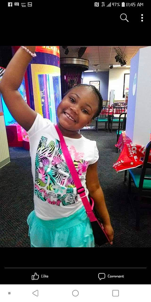 Emonie is registered to the contest to win money with this photo: baby, chair, child, event, fun, gesture, happy, joy, leisure, magenta, party, person, pink, play, purple, room, smile, standing, t_shirt, toddler