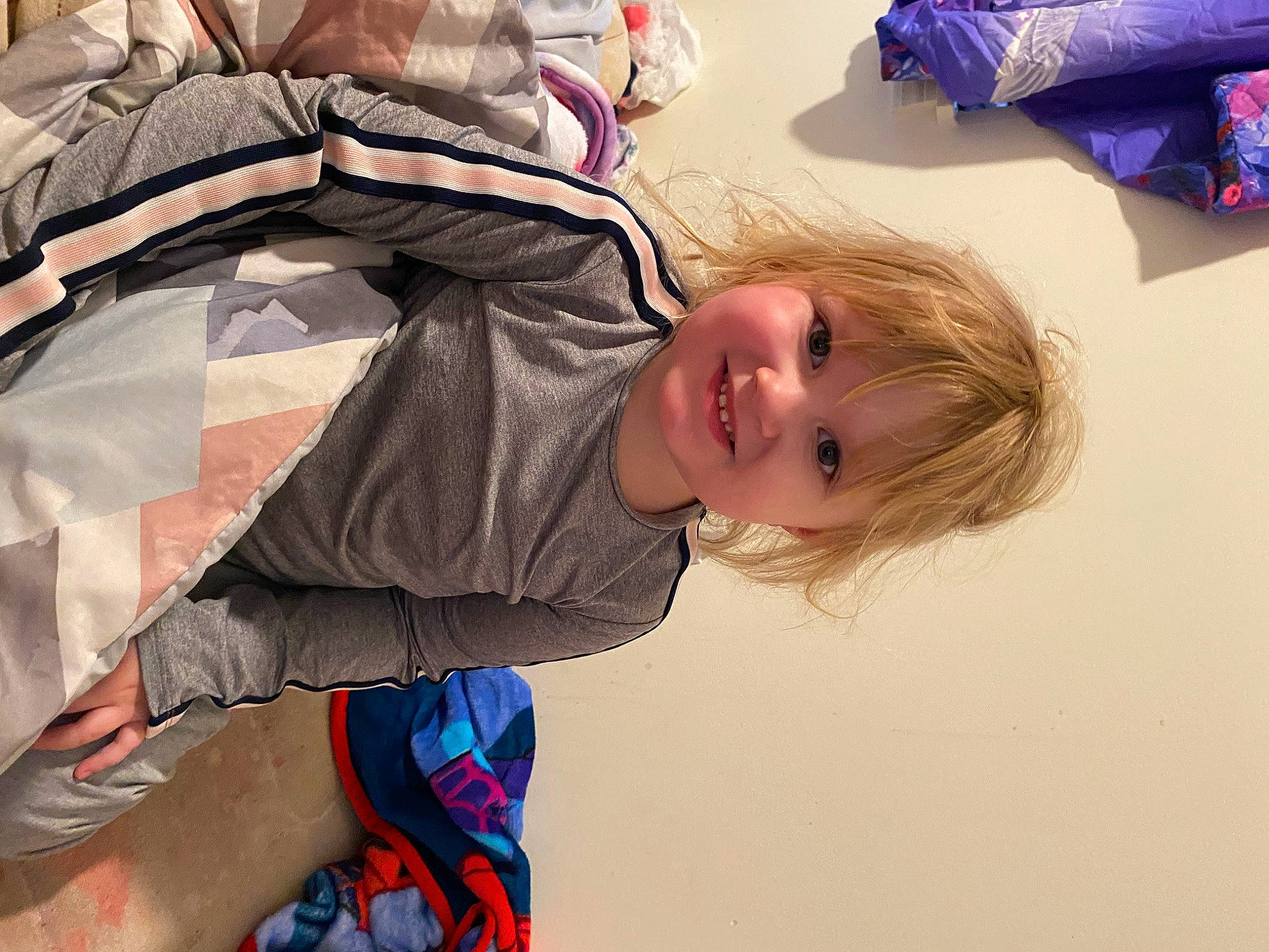 Aria is registered to the contest to win money with this photo: child, comfort, electric_blue, fun, happy, joint, joy, leisure, pattern, person, sleeve, smile, toddler, travel, vacation