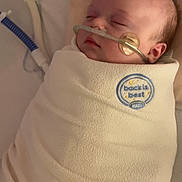 Emberlynn joined the competition — help win amazing prizes! baby, infant, swaddled, sleeping, blanket, medical_tube, nasal_cannula, patch, cheek, soft_texture, quilting, bed, resting, face, closed_eyes, hospital, healthcare, peaceful, medical_care, newborn