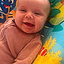 Emberlynn joined the competition — help win amazing prizes! baby, smiling, infant, child, pink_clothing, face, portrait, cushion, colorful, sea_creatures, underwater_theme, toy, happy, closeup, cute, indoors, young_child, baby_girl, playful, comfort