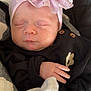 Emberlynn is registered to the contest to win money with this photo: baby, sleeping, headband, flower, pink, black_clothing, blanket, hand, infant, peaceful, cozy, soft, portrait, closeup, cute, newborn, resting, indoors, child, toddler