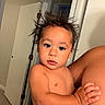 toddler, child, baby, hair, spiky_hair, diaper, indoor, person, skin, arm, hand, face, curious, expression, adult_arm, door, hallway, home, holding, candid