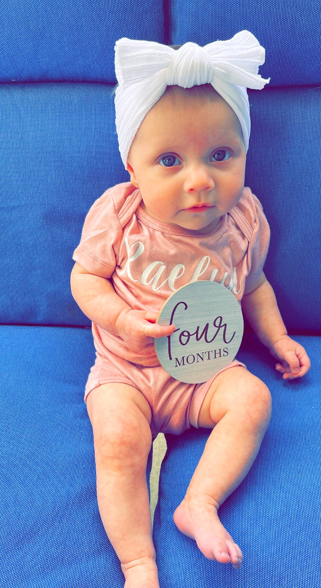 Raelyn joined the competition — help win amazing prizes! baby, baby_toddler_clothing, blue, cap, child, doll, electric_blue, finger, hand, happy, human_leg, nail, person, pink, product, skin, textile, thigh, thumb, toddler