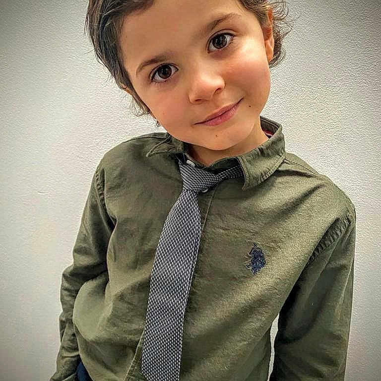Latrell is registered to the contest to win money with this photo: background, boy, buttoned_shirt, casual, child, collar, confident, cute, eyes, face, fashion, hair, indoors, portrait, pose, shirt, smile, standing, tie, young