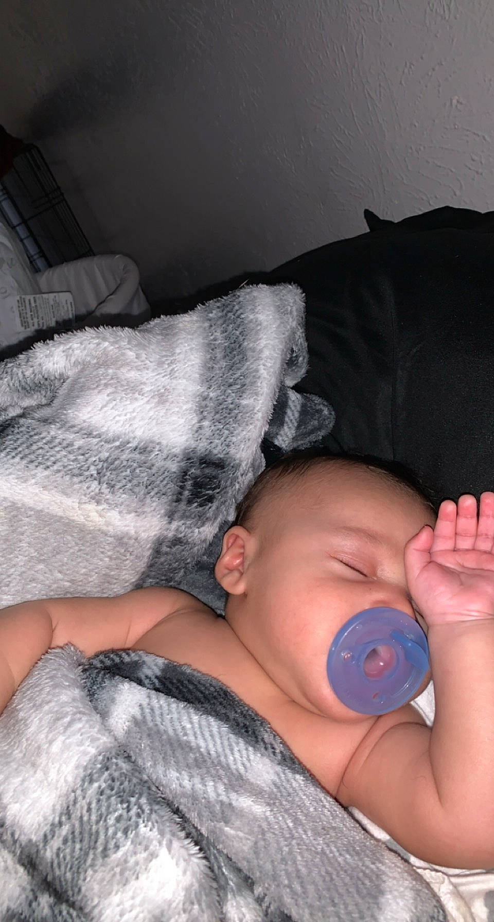 Liam is registered to the contest to win money with this photo: arm, baby, baby_toddler_clothing, cheek, child, comfort, couch, elbow, finger, gesture, hand, joint, linens, mouth, nail, nose, person, shoulder, skin, thumb