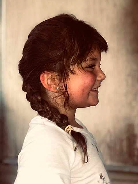 Braylin is registered to the contest to win money with this photo: black_hair, brown_hair, bun, chin, ear, face, feathered_hair, forehead, hair, hairstyle, head, human, jaw, joy, layered_hair, long_hair, mouth, neck, nose, person