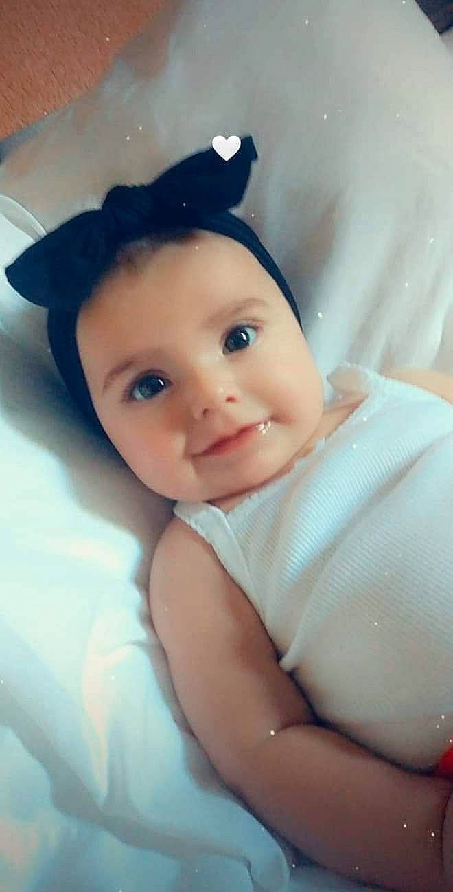 Sophia is registered to the contest to win money with this photo: baby, cheek, child, eye, face, forehead, head, headgear, lip, person, skin, smile, toddler