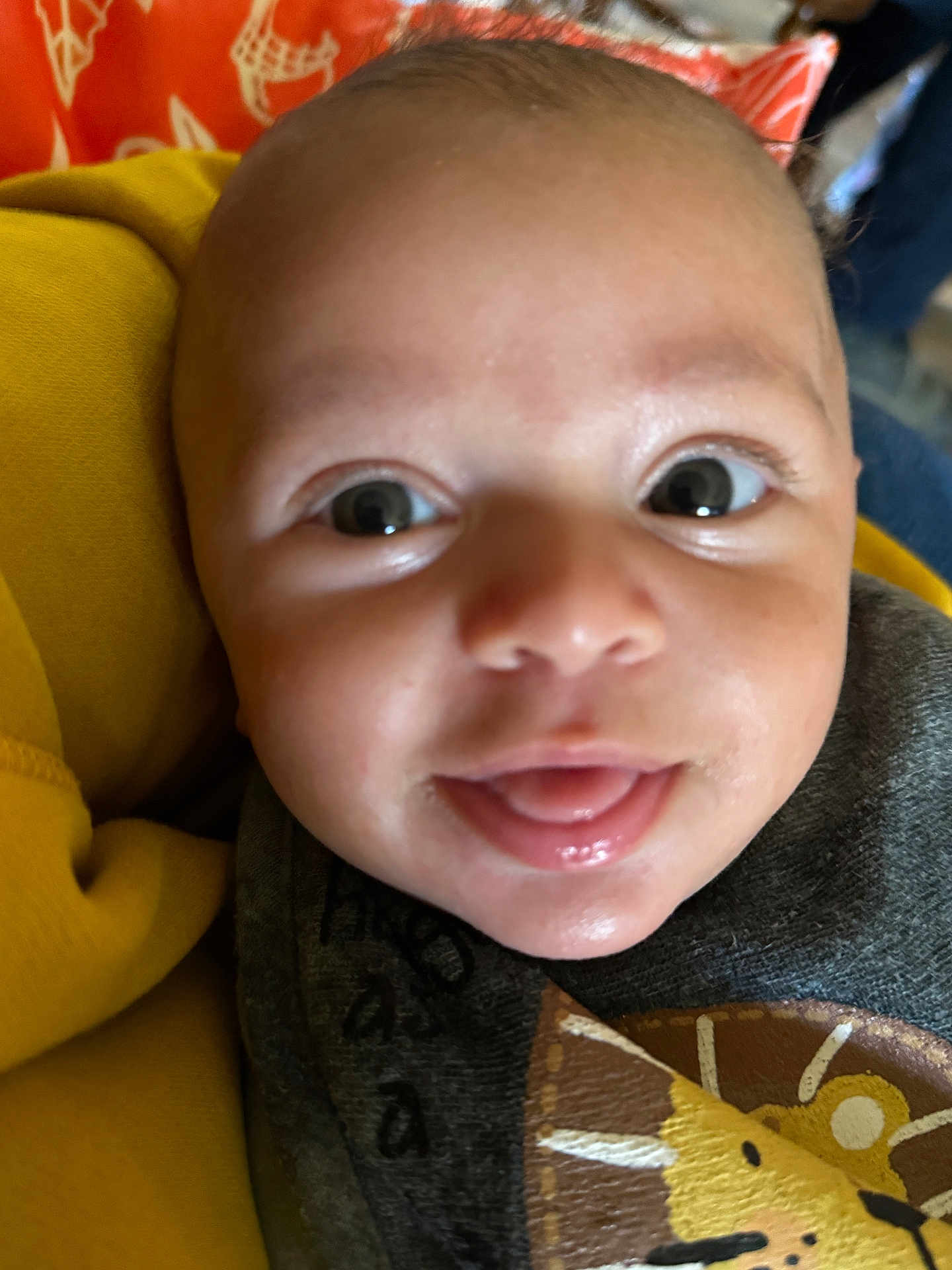 Kaedyn joined the competition — help win amazing prizes! baby, close_up, smiling, tongue_out, face, eyes, infant, yellow_blanket, clothing, lion_patch, cute, child, portrait, soft_light, indoor, person, skin, head, happy, young