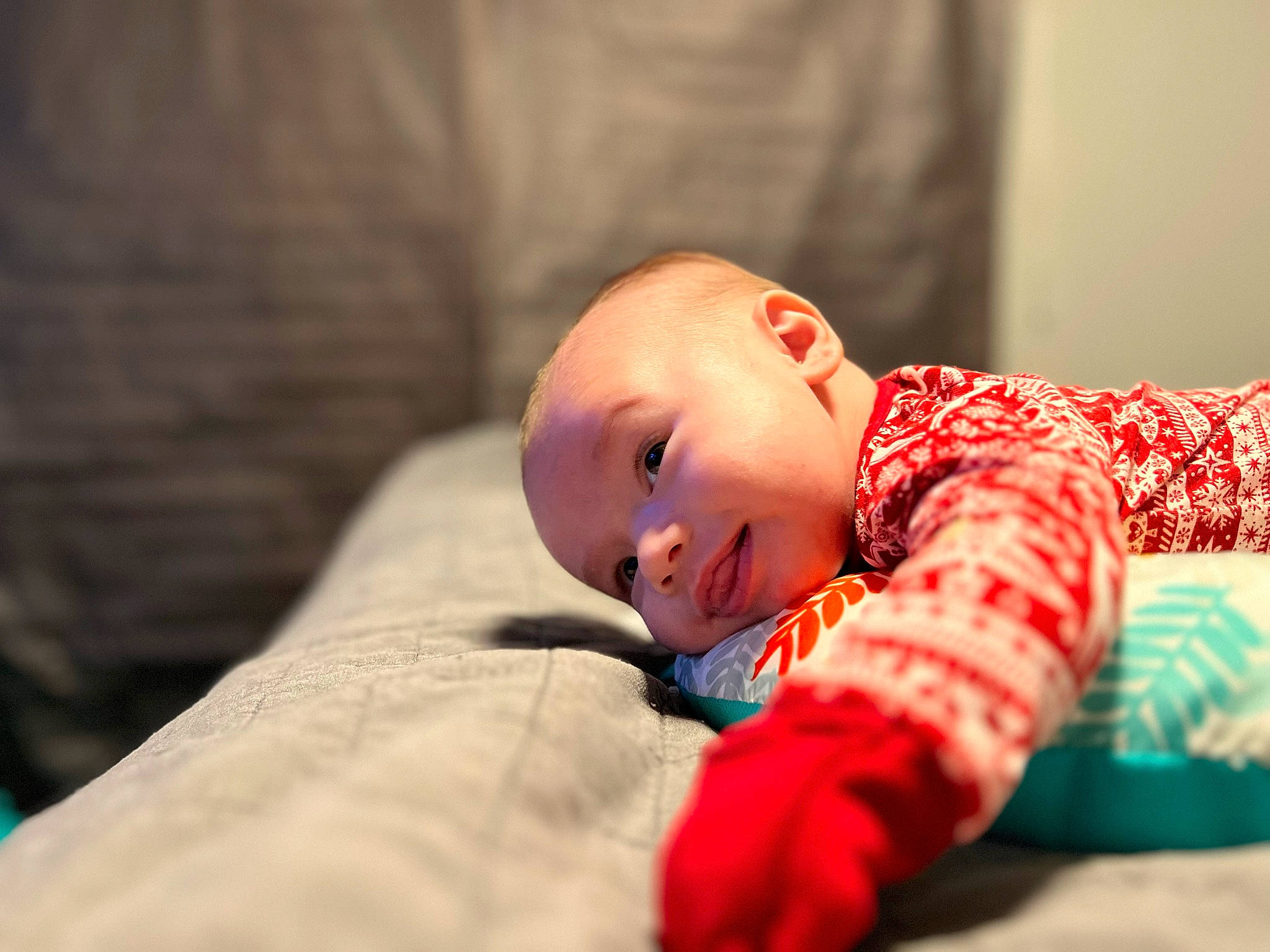 Declan joined the competition — help win amazing prizes! baby, baby_toddler_clothing, child, comfort, eye, flash_photography, flooring, fun, happy, human_body, linens, pattern, person, portrait_photography, room, sitting, sleeve, smile, toddler, tummy_time