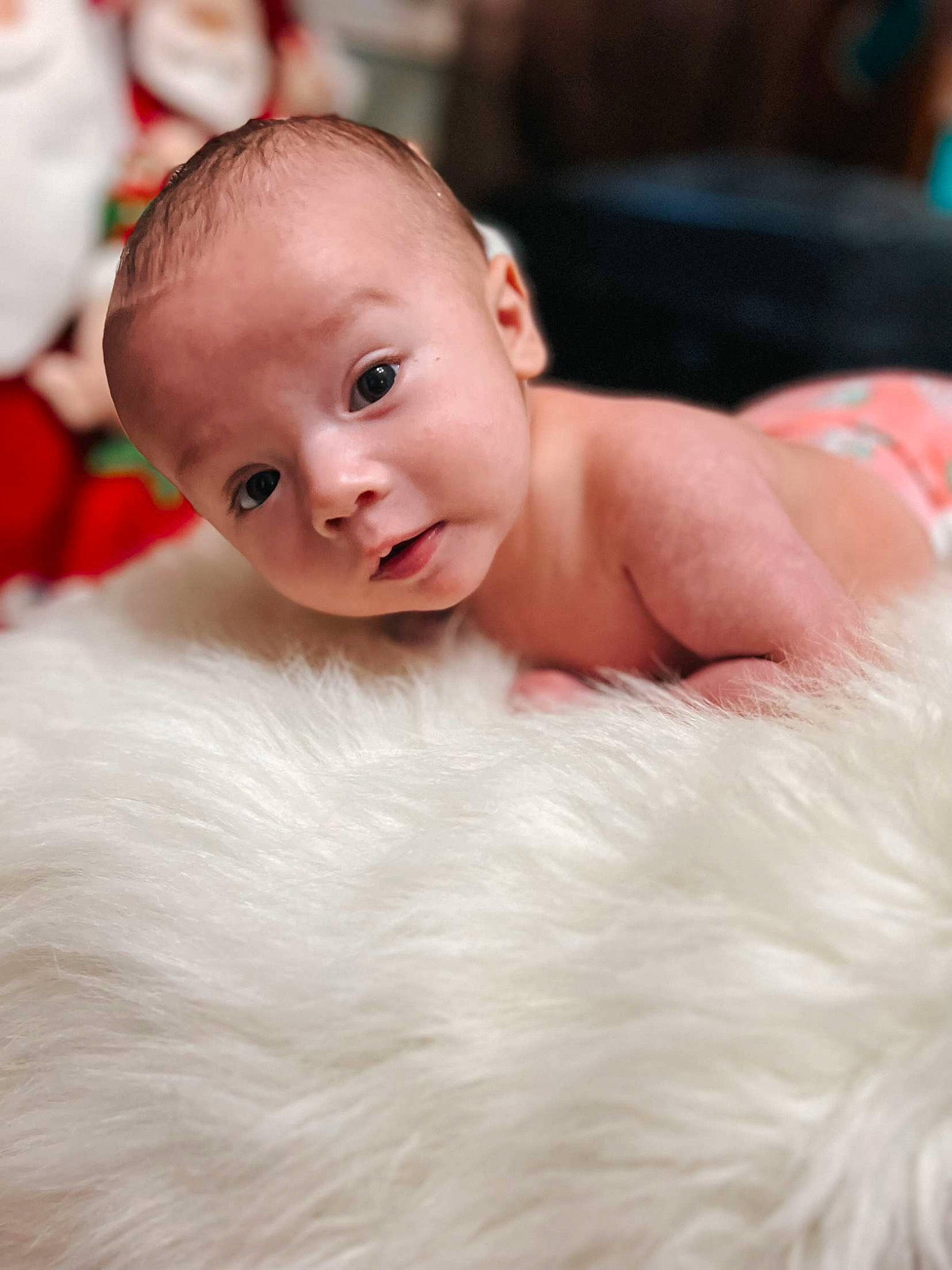 Declan is registered to the contest to win money with this photo: baby, baby_toddler_clothing, cheek, child, close_up, comfort, event, flash_photography, flooring, fun, fur, happy, head, iris, linens, person, portrait_photography, sitting, skin, smile