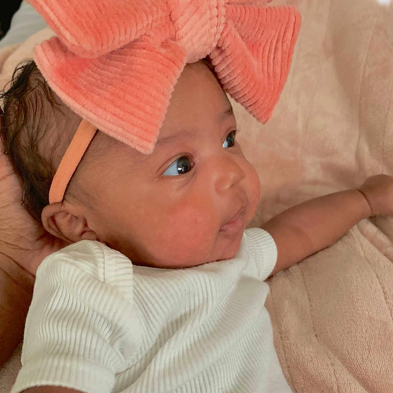 Cyrie is registered to the contest to win money with this photo: baby, bed, blanket, bodypart, cap, clothing, couch, cushion, face, finger, furniture, hand, hat, head, homedecor, newborn, person, photography, portrait, towel