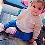 Abidi Amira participe au concours pour gagner de l'argent avec cette photo : child, toddler, toy, unicorn, carpet, indoor, cute, smile, curly_hair, pants, blouse, shoes, playtime, colorful, sitting, person, young_child, home, floor, happy