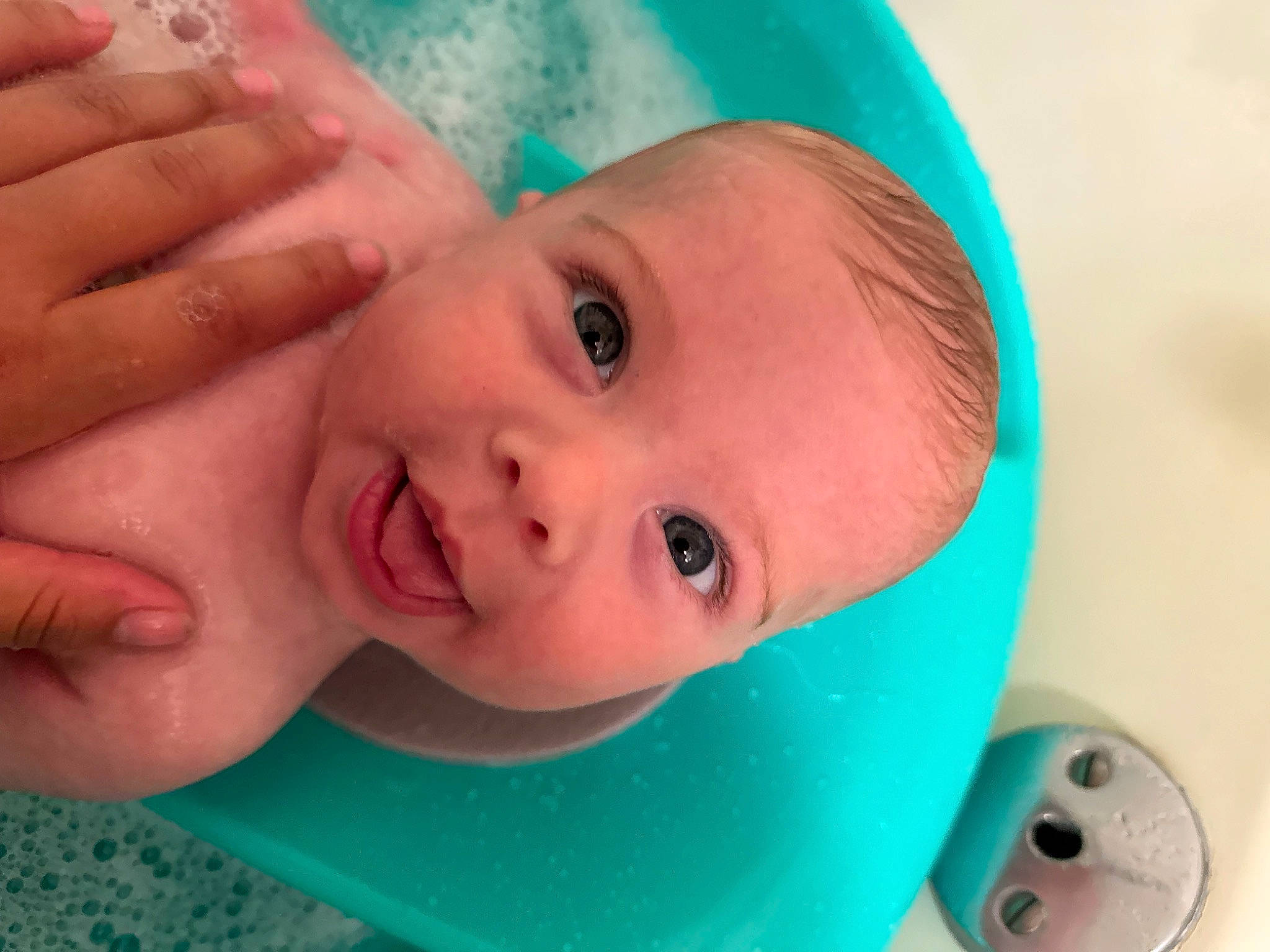 Tiger is registered to the contest to win money with this photo: arm, baby, blue, cheek, chin, eye, eyebrow, eyelash, face, finger, gesture, happy, head, iris, lip, mouth, nose, person, skin, smile