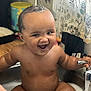baby, sink, water, smiling, happy, faucet, bath, child, indoor, curtain, kitchen, cute, toddler, bare_chest, joyful, face, person, sitting, fun, playful