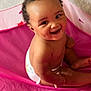 baby, child, smile, diaper, tent, pink, curly_hair, dimples, sitting, indoor, happy, cute, skin, infant, playtime, young_child, portrait, person, joyful, cheerful