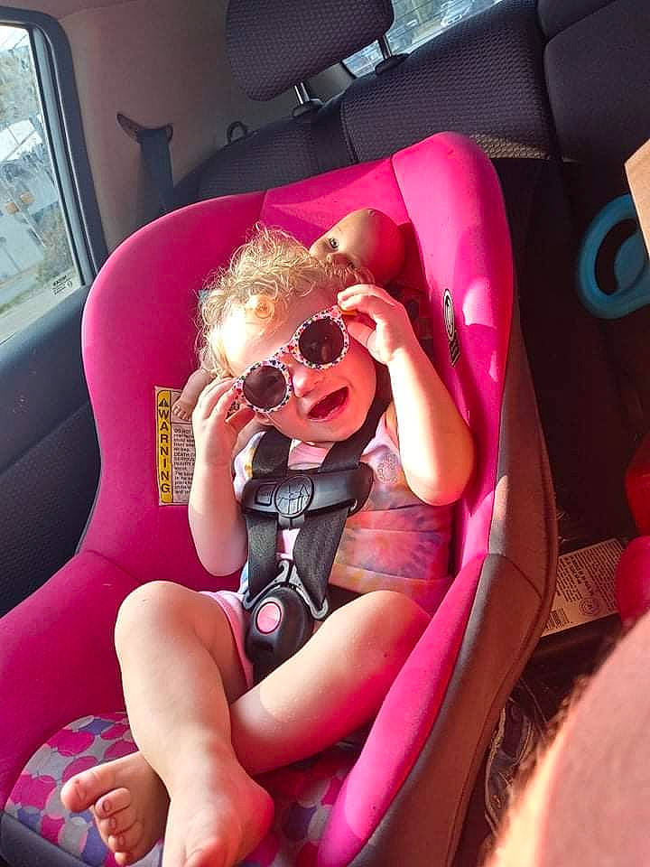 Paisley joined the competition — help win amazing prizes! automotive_design, automotive_exterior, car_seat, car_seat_cover, comfort, eyewear, goggles, lap, leg, magenta, motor_vehicle, mouth, person, pink, shorts, steering_part, steering_wheel, sunglasses, thigh, vehicle_door