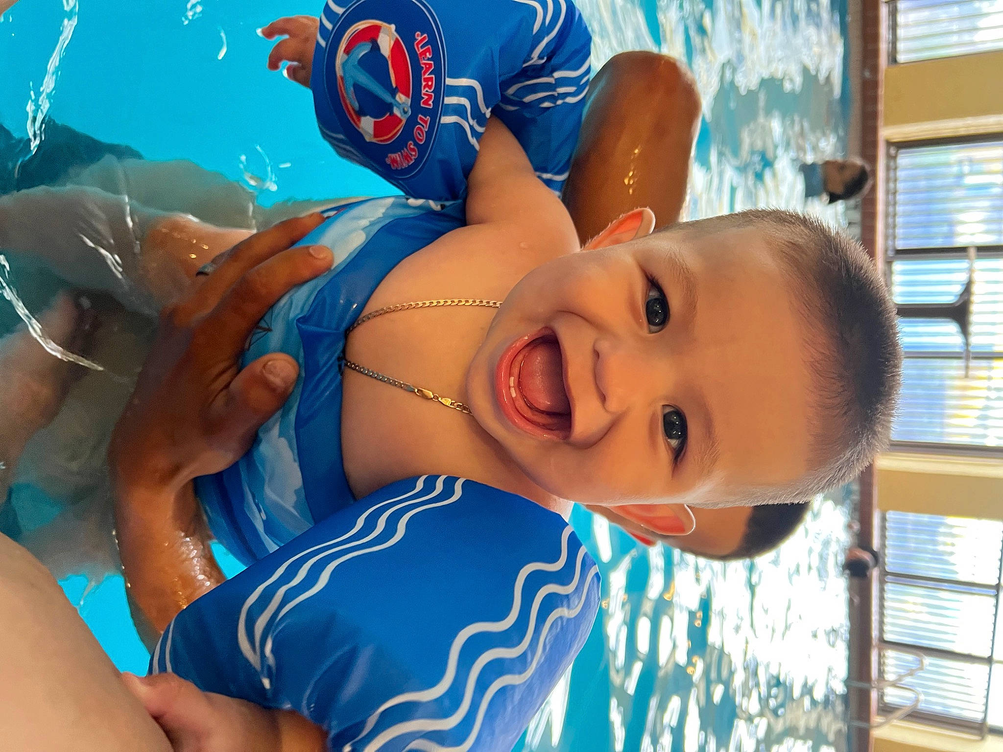 Adrian joined the competition — help win amazing prizes! azure, baby, baby_laughing, baby_toddler_clothing, chest, child, electric_blue, fun, happy, hat, leisure, person, personal_protective_equipment, recreation, smile, summer, toddler, vacation, water, window
