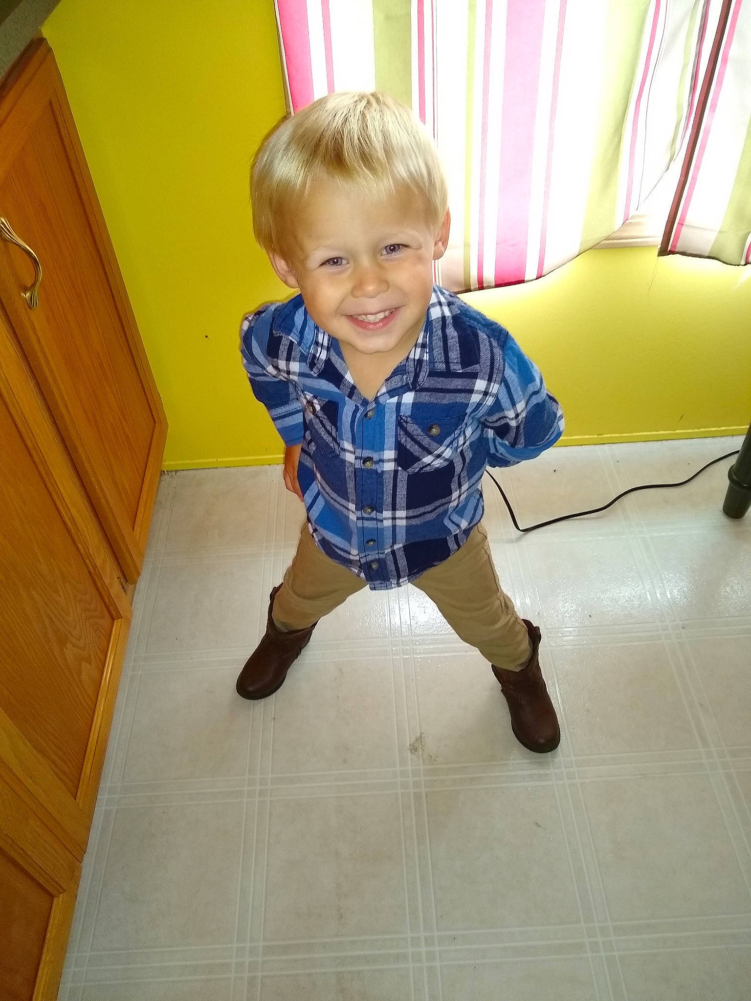Levi is registered to the contest to win money with this photo: child, floor, flooring, joy, leg, pattern, person, play, shoe, shoulder, sitting, standing, tile, toddler, wood