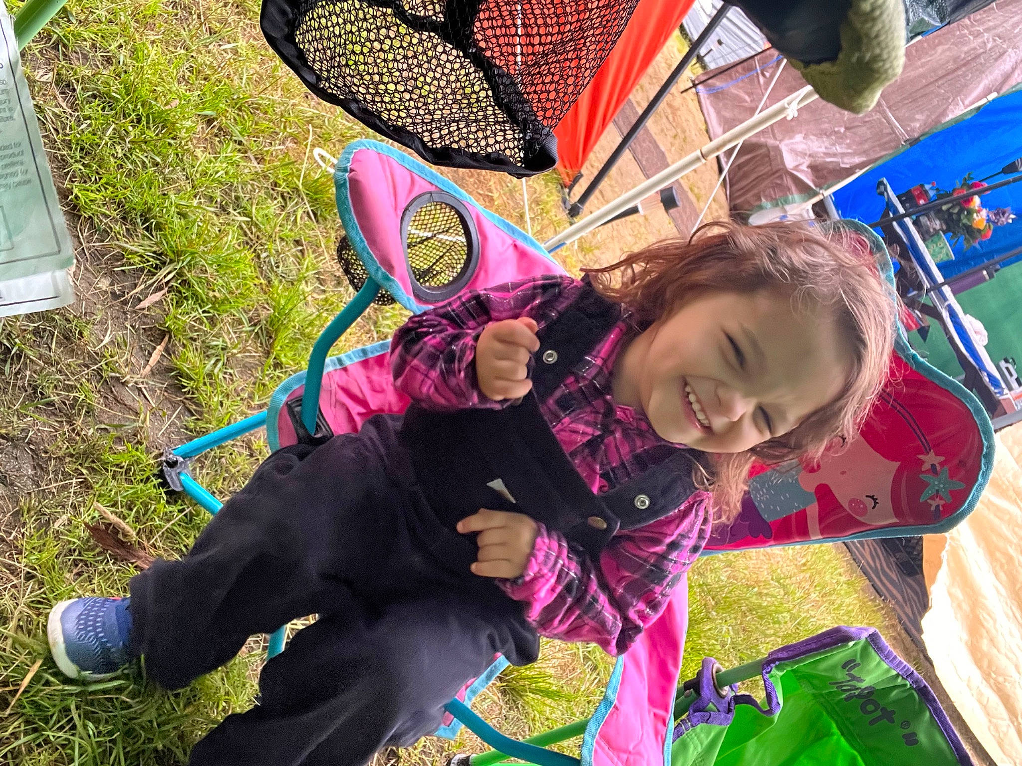 Anna Grace joined the competition — help win amazing prizes! boot, child, child_art, event, fun, grass, green, happy, joy, leisure, pattern, person, play, public_space, recreation, shoe, sitting, smile, sneakers, soil