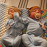 baby, newborn, pacifier, hat, blanket, crocheted_blanket, sleeping, motion_blur, infant, blue_outfit, lying_down, toddler, cute, child, soft_lighting, indoor, person, two_babies, matching_clothes, cozy
