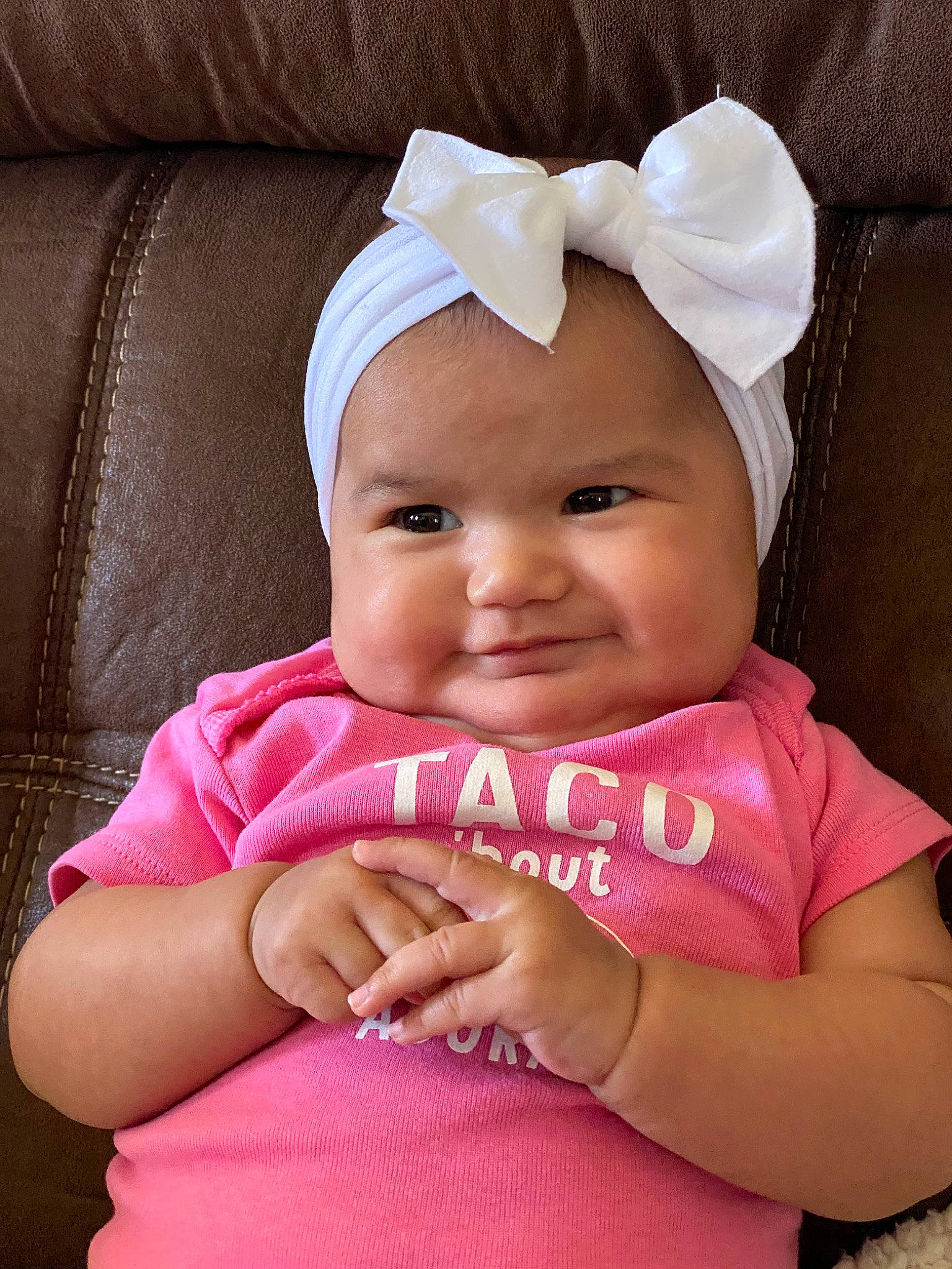 Anelise is registered to the contest to win money with this photo: baby, baby_making_funny_faces, baby_products, baby_toddler_clothing, cheek, child, fashion_accessory, finger, hair_accessory, hand, headgear, headwear, joy, person, pink, skin, smile, toddler