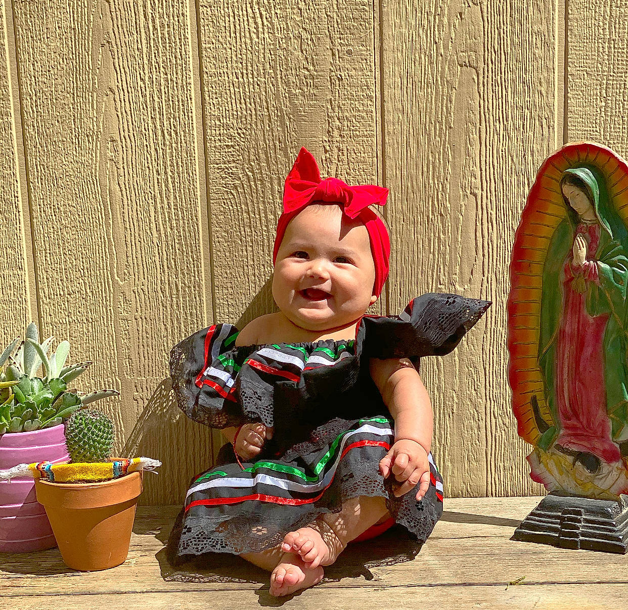Anelise joined the competition — help win amazing prizes! child, fun, garden_gnome, happy, headwear, joy, lawn_ornament, person, sitting, smile, statue, toddler