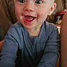baby, child, infant, smiling, happy, laughing, portrait, face, blue_eyes, indoor, couch, leather, lamp, home, living_room, sitting, shirt, long_sleeves, close_up, photography