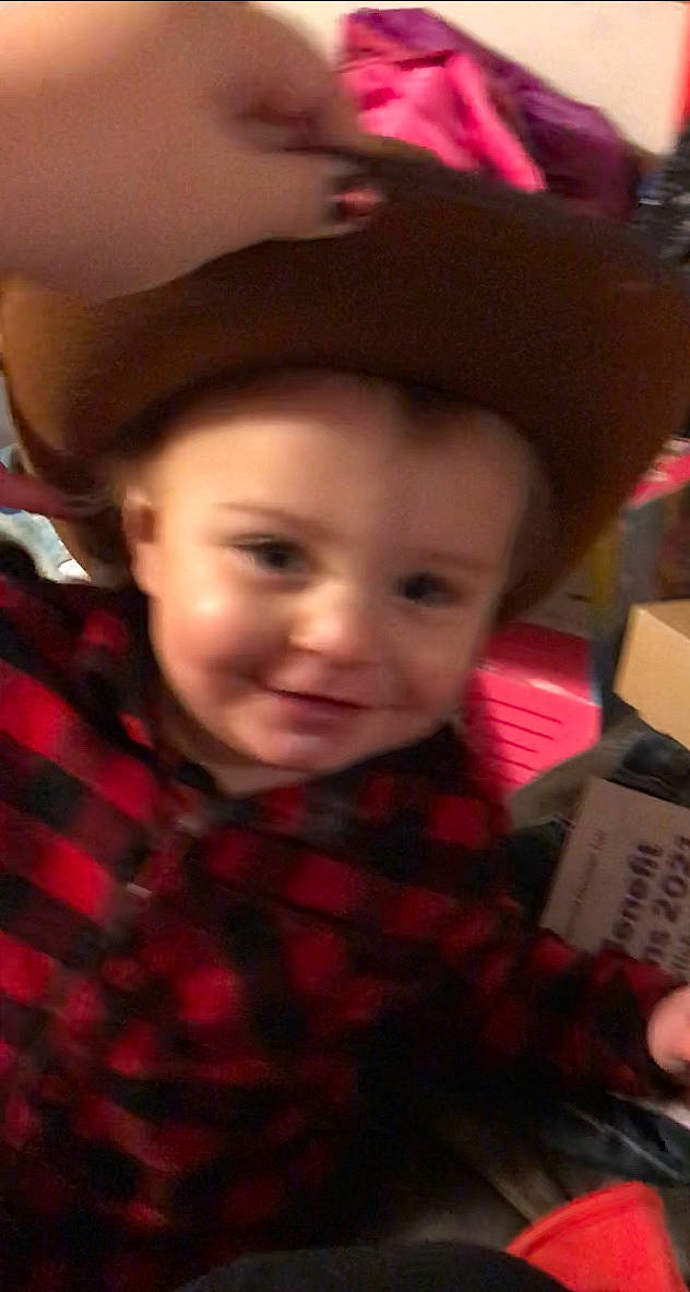 Waylon is registered to the contest to win money with this photo: baby, cheek, child, chin, cool, eyebrow, facial_expression, forehead, fun, headgear, interaction, iris, joy, lip, organ, pattern, person, photograph, plaid, red