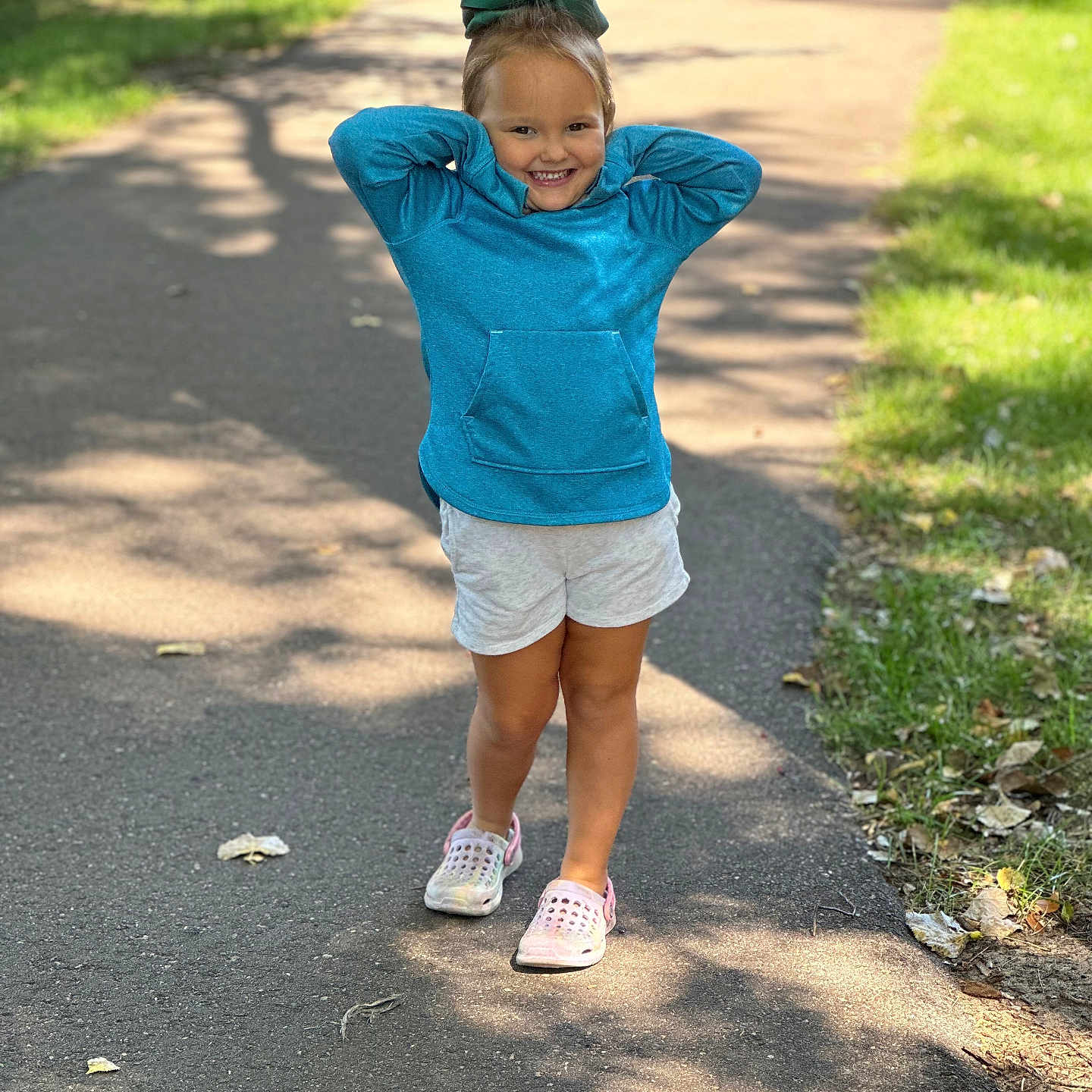 Karsen is registered to the contest to win money with this photo: boy, city, clothing, face, footwear, grass, head, pants, path, person, photography, plant, portrait, road, sandal, shoe, shorts, street, urban, walking