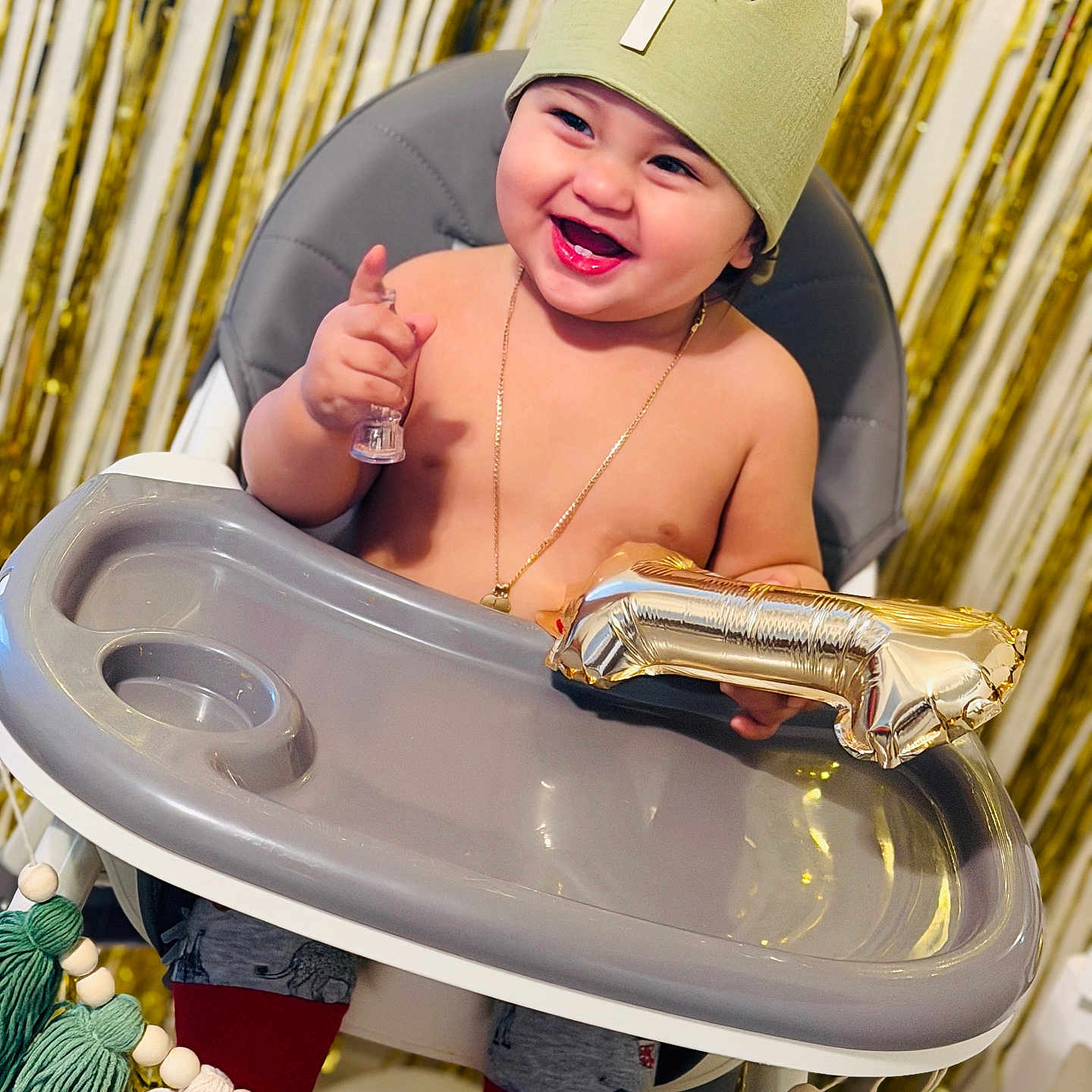 Bryant joined the competition — help win amazing prizes! baby, child, high_chair, birthday, crown, number_one, balloon, smile, happy, celebration, party, gold, decorations, toddler, clothing, indoor, person, jewelry, hand, face