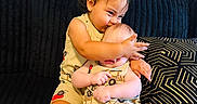 Bryant joined the competition — help win amazing prizes! baby, toddler, child, couch, cushion, black_couch, matching_outfits, siblings, indoor, cute, affection, hug, kiss, playful, clothing, person, smile, home, seated, black_sock