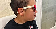 Anders Corria joined the competition — help win amazing prizes! bathroom, black_clothing, casual, child, door, facial_profile, fashion, indoors, photography, portrait, profile, red_glasses, safe, short_hair, sitting, stationary, sunglasses, wall, window, young_boy