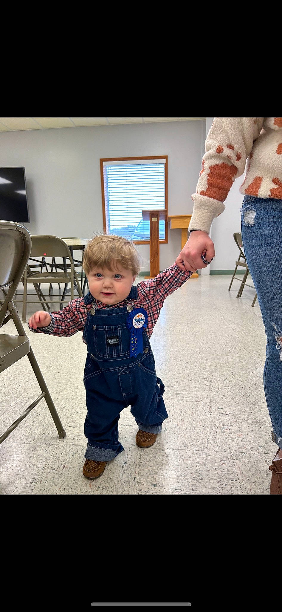 Lennox joined the competition — help win amazing prizes! baby, baby_toddler_clothing, chair, child, denim, electric_blue, event, flooring, fun, gesture, happy, person, picture_frame, play, shoe, sitting, sleeve, sneakers, standing, t_shirt