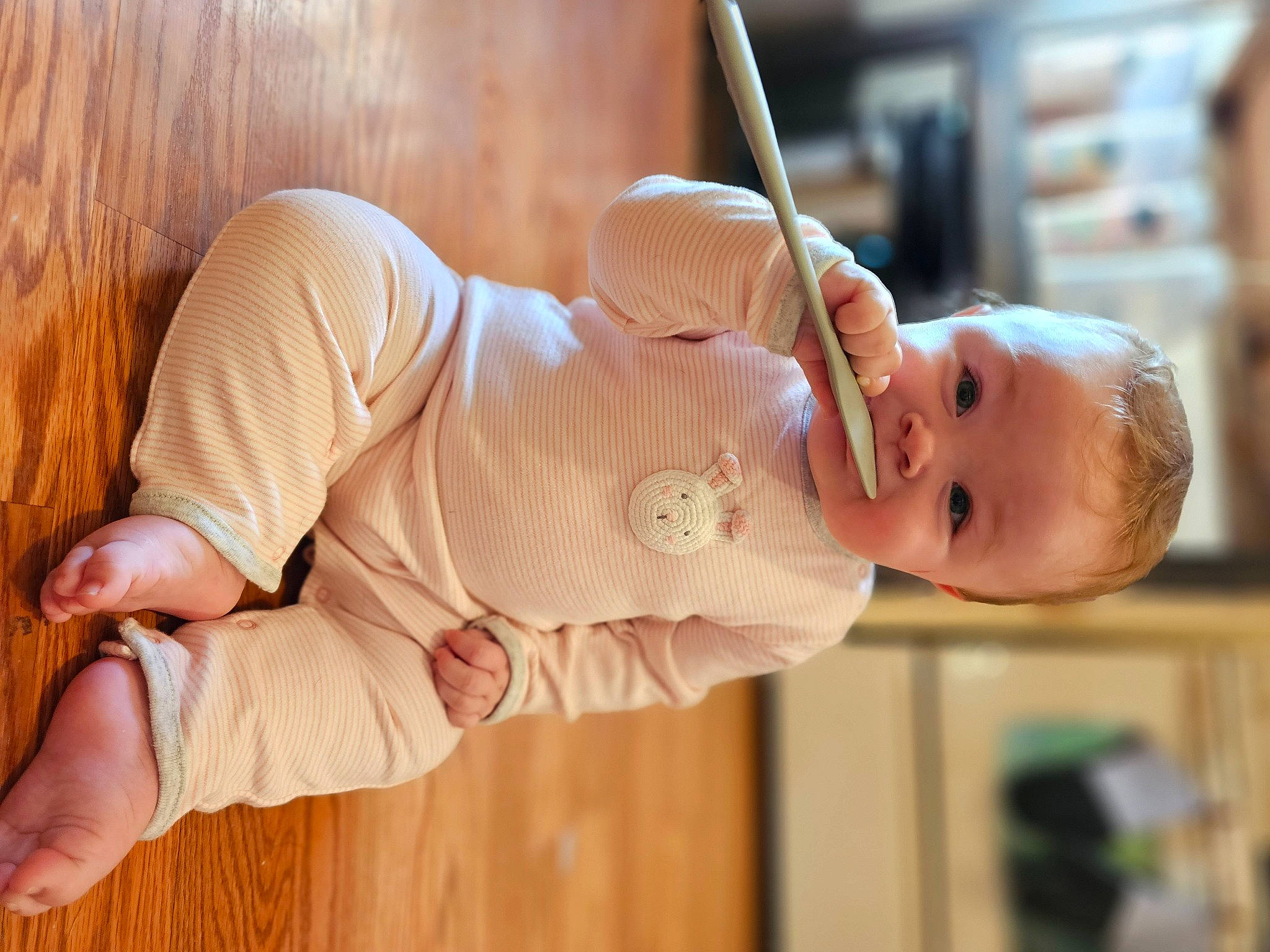 Cassidy is registered to the contest to win money with this photo: baby, baby_toddler_clothing, child, collar, comfort, elbow, finger, flooring, happy, hardwood, hat, orange, peach, person, sitting, skin, sleeve, smile, thumb, toddler