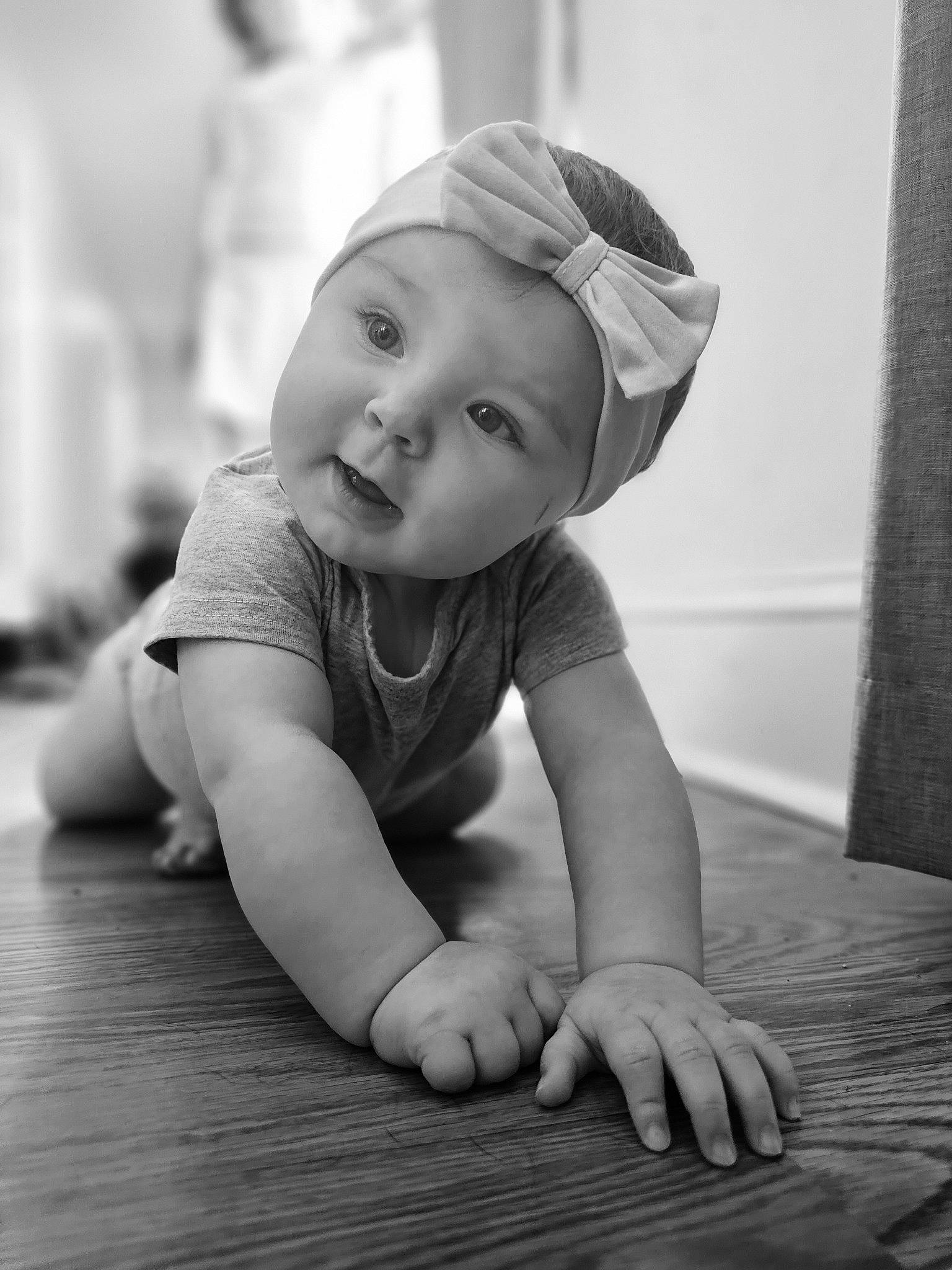 Cassidy joined the competition — help win amazing prizes! baby, baby_crawling, baby_toddler_clothing, black, black_and_white, cheek, comfort, curtain, flash_photography, floor, flooring, fun, grey, happy, headwear, iris, person, skin, standing, toddler