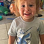 Dominic joined the competition — help win amazing prizes! toddler, child, smiling, indoor, tshirt, shark_graphic, short_sleeves, blue_pants, tile_floor, toys, messy_background, blond_hair, happy, person, casual_clothing, playtime, young_child, cute, standing, home