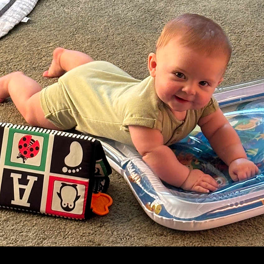 Everette joined the competition — help win amazing prizes! alphabet_block, baby, carpet, child, chubby_cheeks, colorful, cute, face, footprint, happy, indoors, infant, inflatable, ladybug, onesie, penguin, playtime, smiling, toy, tummy_time