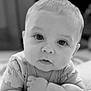 arms, baby, black_and_white, child, chubby_cheeks, close_up, crawling, curious, cute, expression, eyes, face, head, indoors, infant, person, portrait, sleepwear, soft_background, young