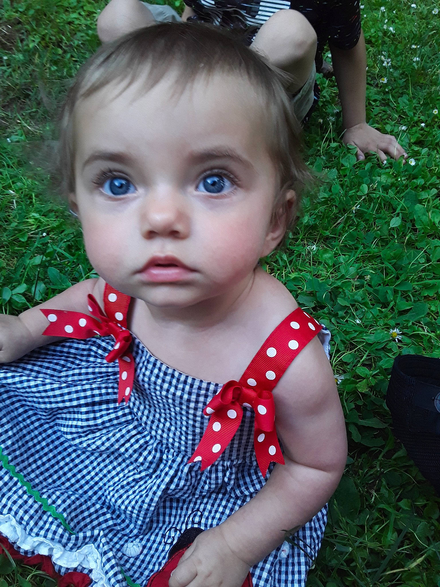 Maizey is registered to the contest to win money with this photo: baby, baby_toddler_clothing, cheek, child, child_model, design, dress, fashion_accessory, fawn, grass, leaf, lip, pattern, person, plant, skin, summer, toddler